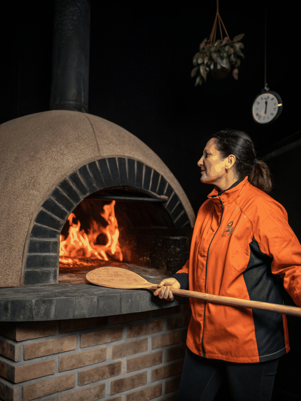 Elena Moretti tending to the open-fire grill
